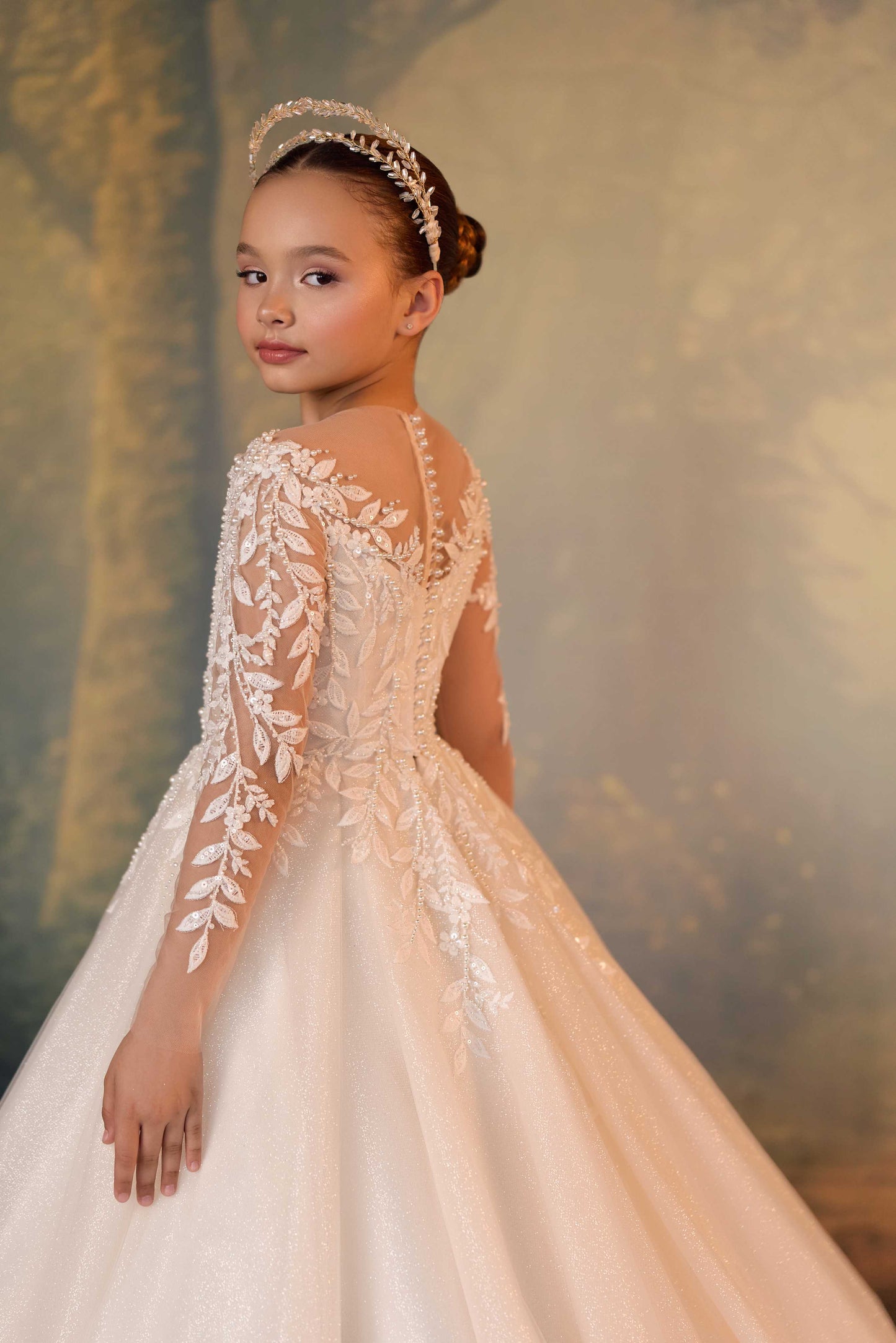 Side view showcasing the huge voluminous silhouette of a shimmering ivory white princess dress.