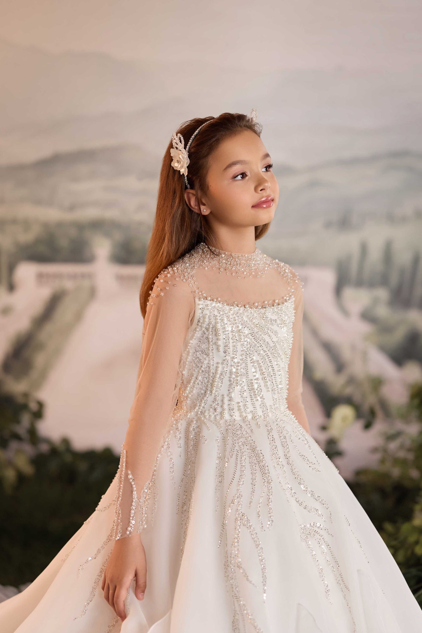 Emery girls couture dress in ivory with embellished bodice and flowing skirt