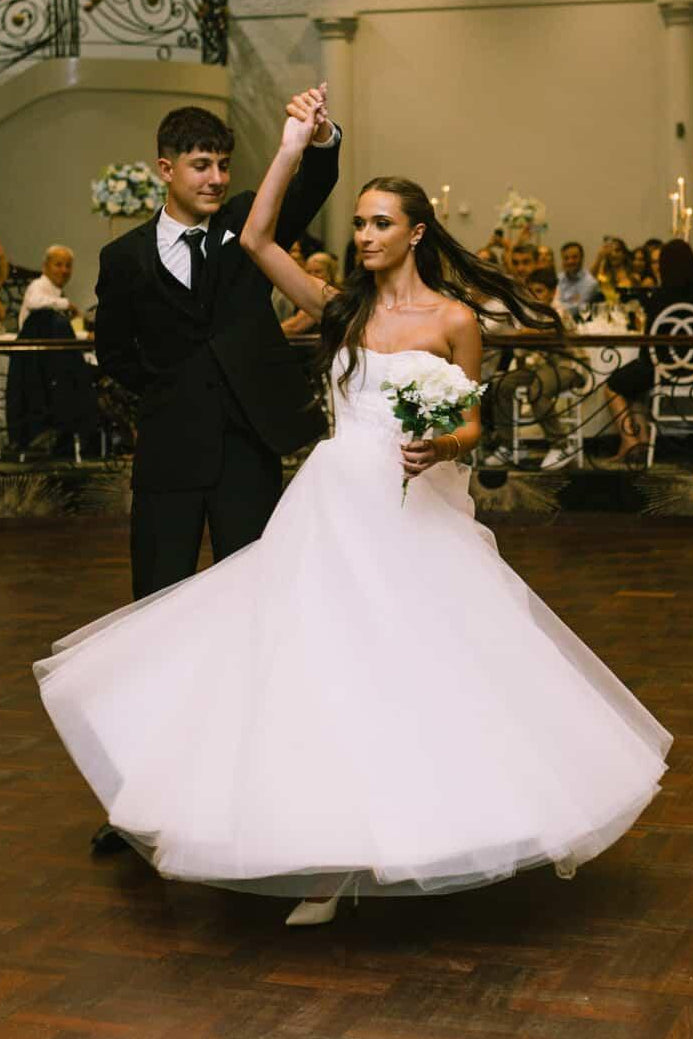 twirling in a beautiful white debutant dress