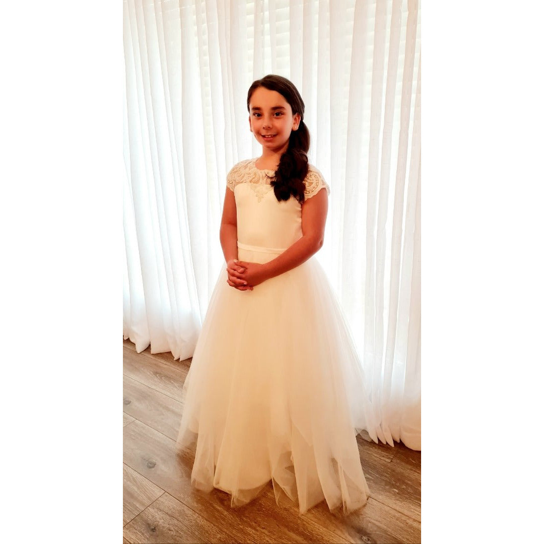 Communion dress with beaded lace and layers of plush netting.