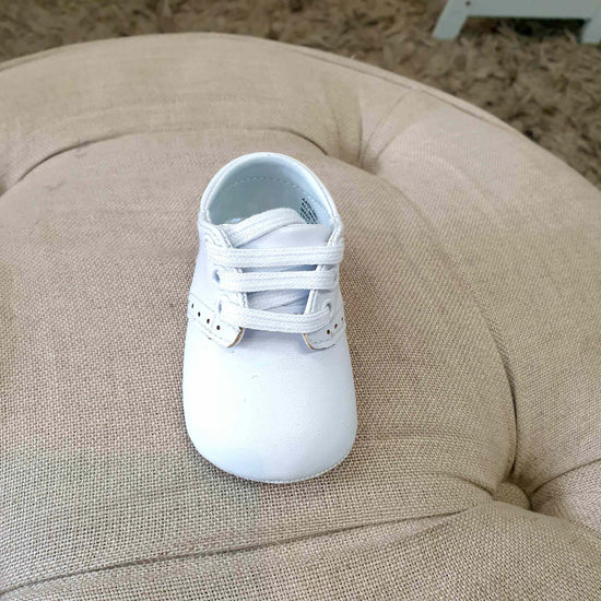 boys tie up white christening shoes